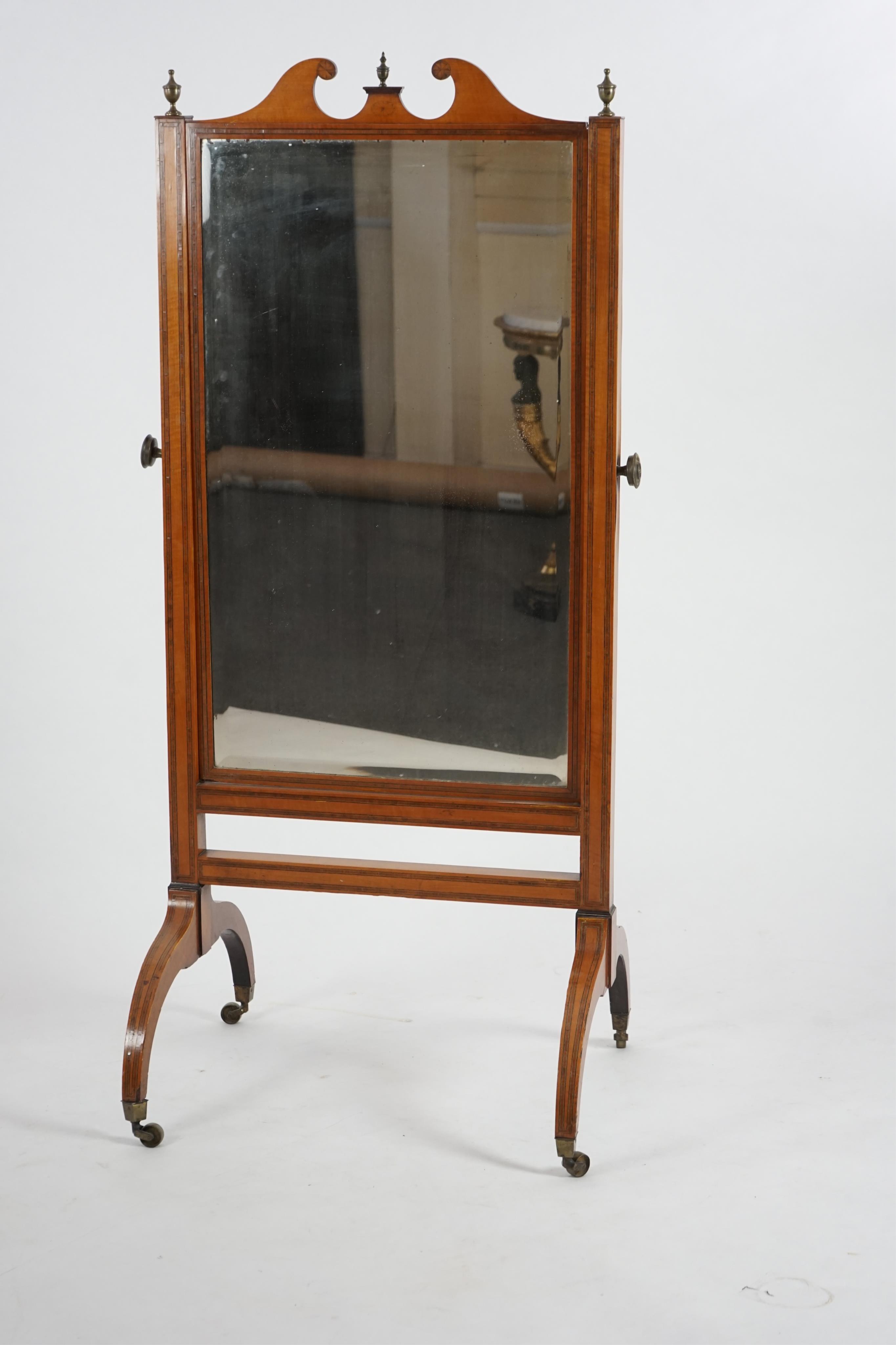 An Edwardian satinwood cheval mirror